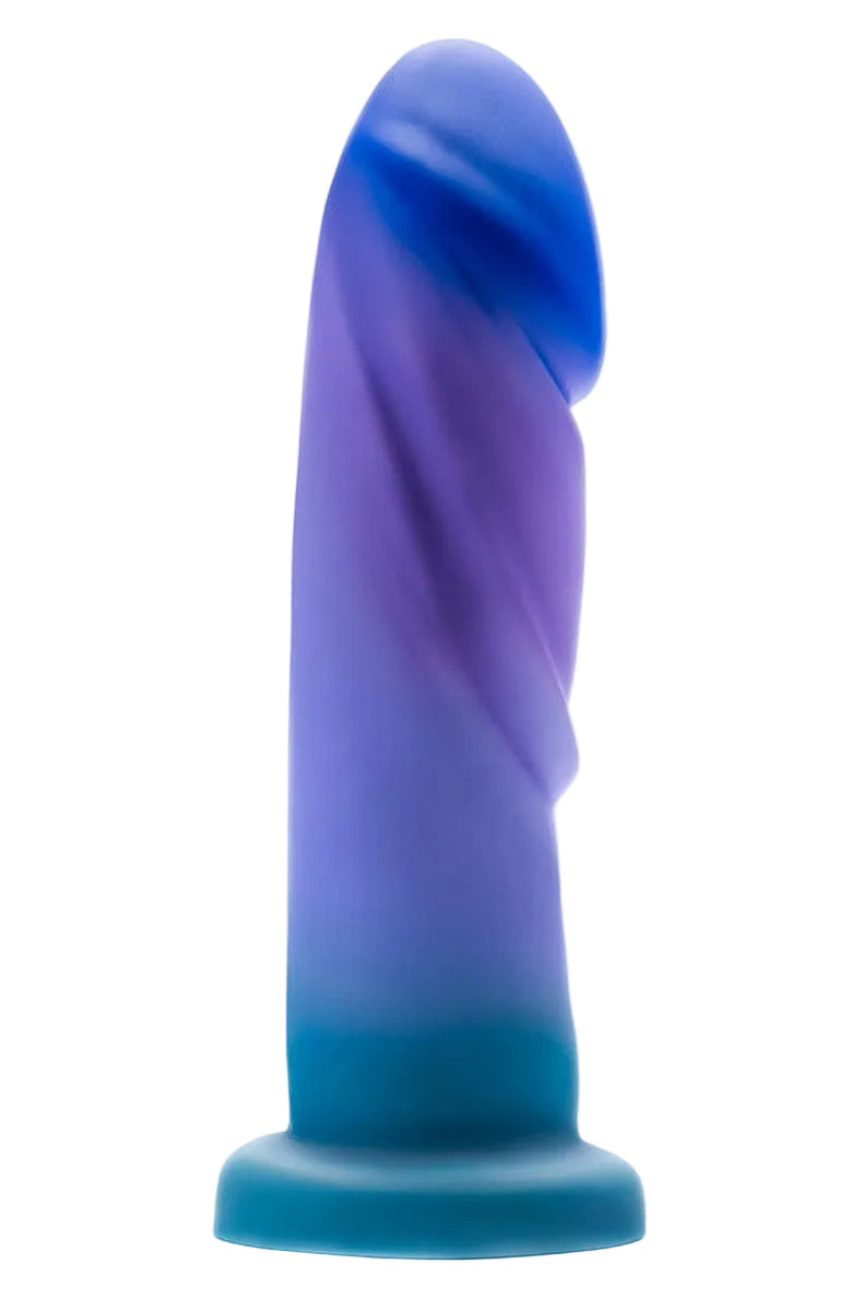 Blue, purple and teal ombre silicone dildo with textured ridges on a suction cup base