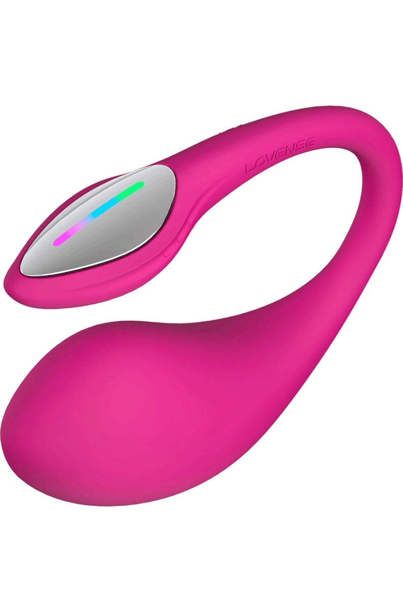 Three-quarter view of pink G-spot vibrator on white surface showing curved design