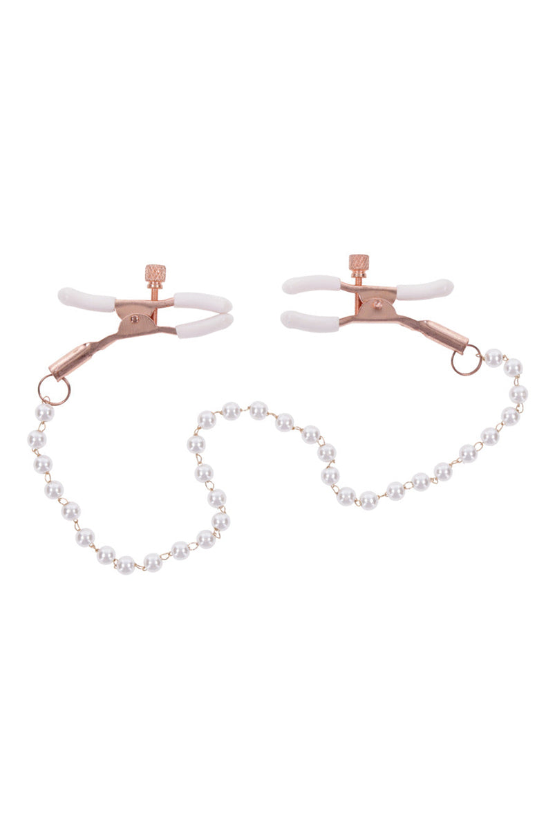 Close-up of rose-gold tweezer clamp jaws with white rubber tips and adjustable slider ring.