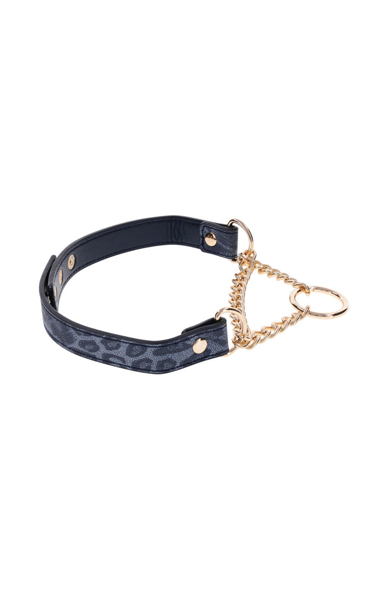 Side view of the dark blue leopard-print martingale collar with gold chain loop and hanging gold O-ring at the front.