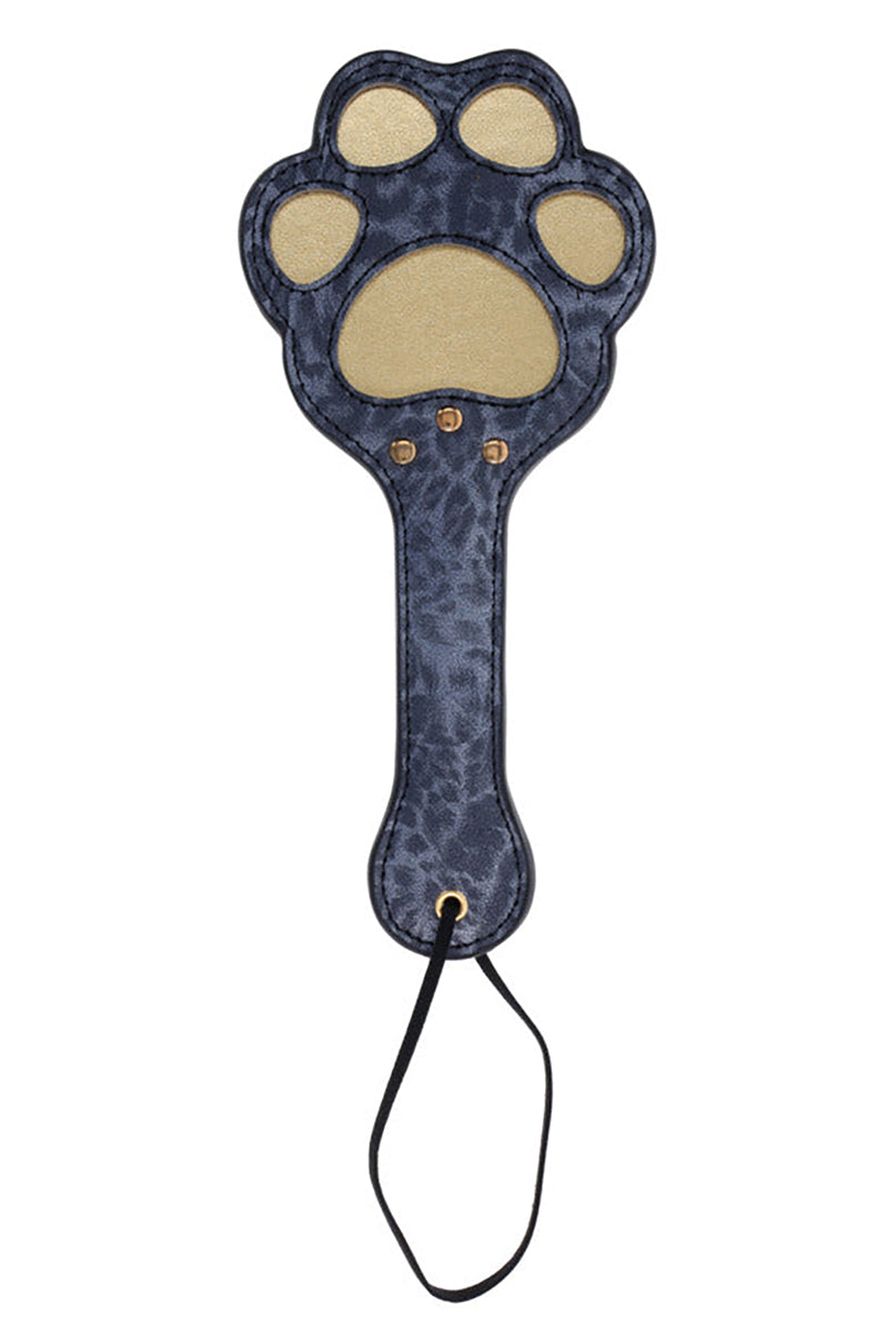 Dark blue leopard-print faux leather paddle with a paw-shaped head featuring gold cutout pads and a black wrist loop.