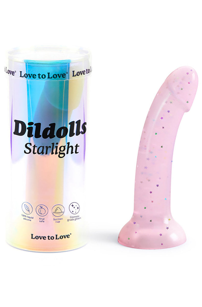 Dildoll Starlight pastel pink silicone dildo with holographic stars, side angle, flared base.