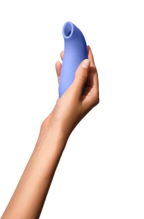 Hand holding periwinkle suction toy showing size scale