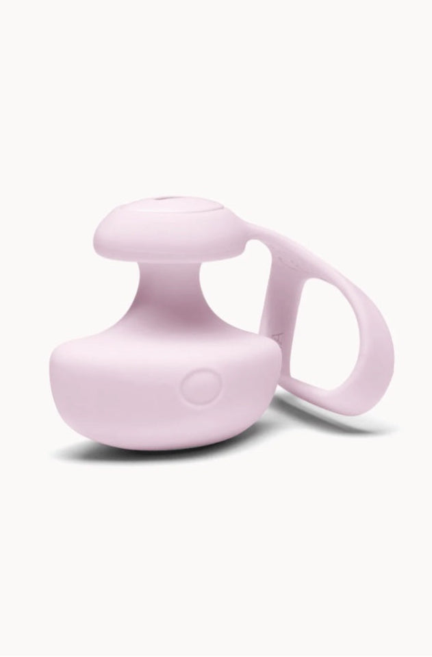 Front view of pale pink silicone finger vibrator with mushroom-shaped top and curved tether strap