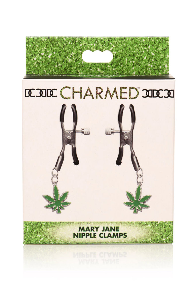 Detail view of green enameled cannabis-leaf charm hanging from silver tweezer nipple clamp.