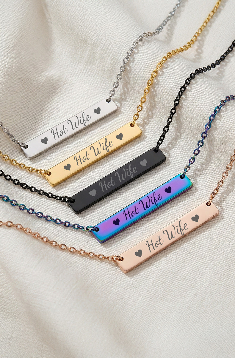 Five Hot Wife bar pendants showing silver, gold, black, rainbow iridescent, and rose gold finishes