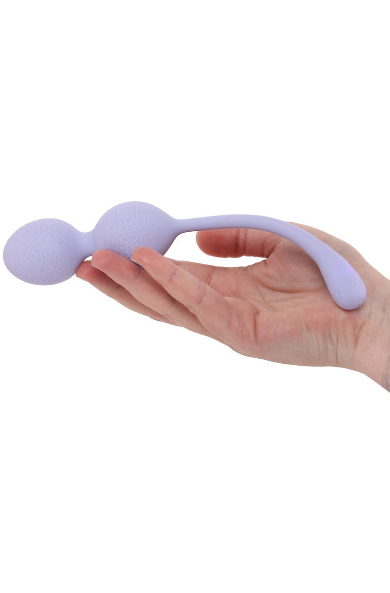 Hand holding the lavender duo-bead kegel vibrator, showing its size and textured beads.