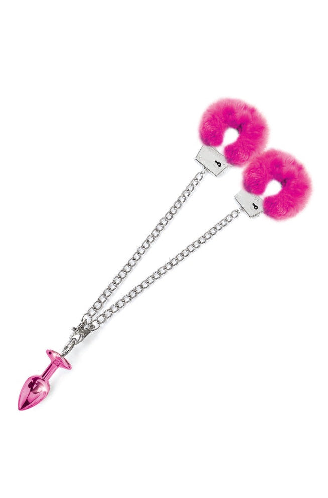 Pink fur-lined metal handcuffs connected by silver chain to pink metal butt plug