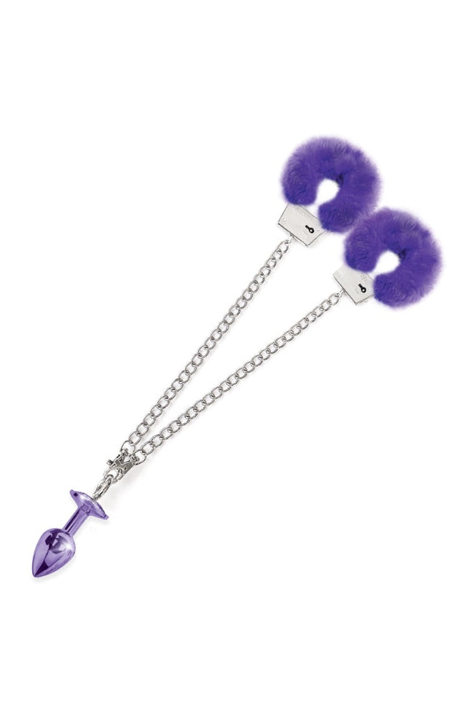Side view of purple fur-lined handcuffs connected by silver chain on white background
