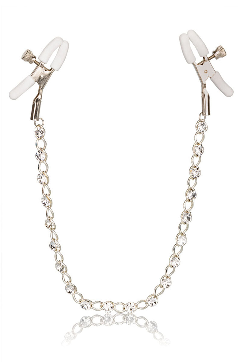 Silver tweezer nipple clamps with white rubber tips connected by a chain of sparkling clear crystals in silver settings.