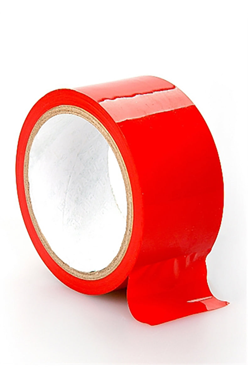Roll of shiny red PVC bondage tape with a loose tail unrolling from the spool on a white background.