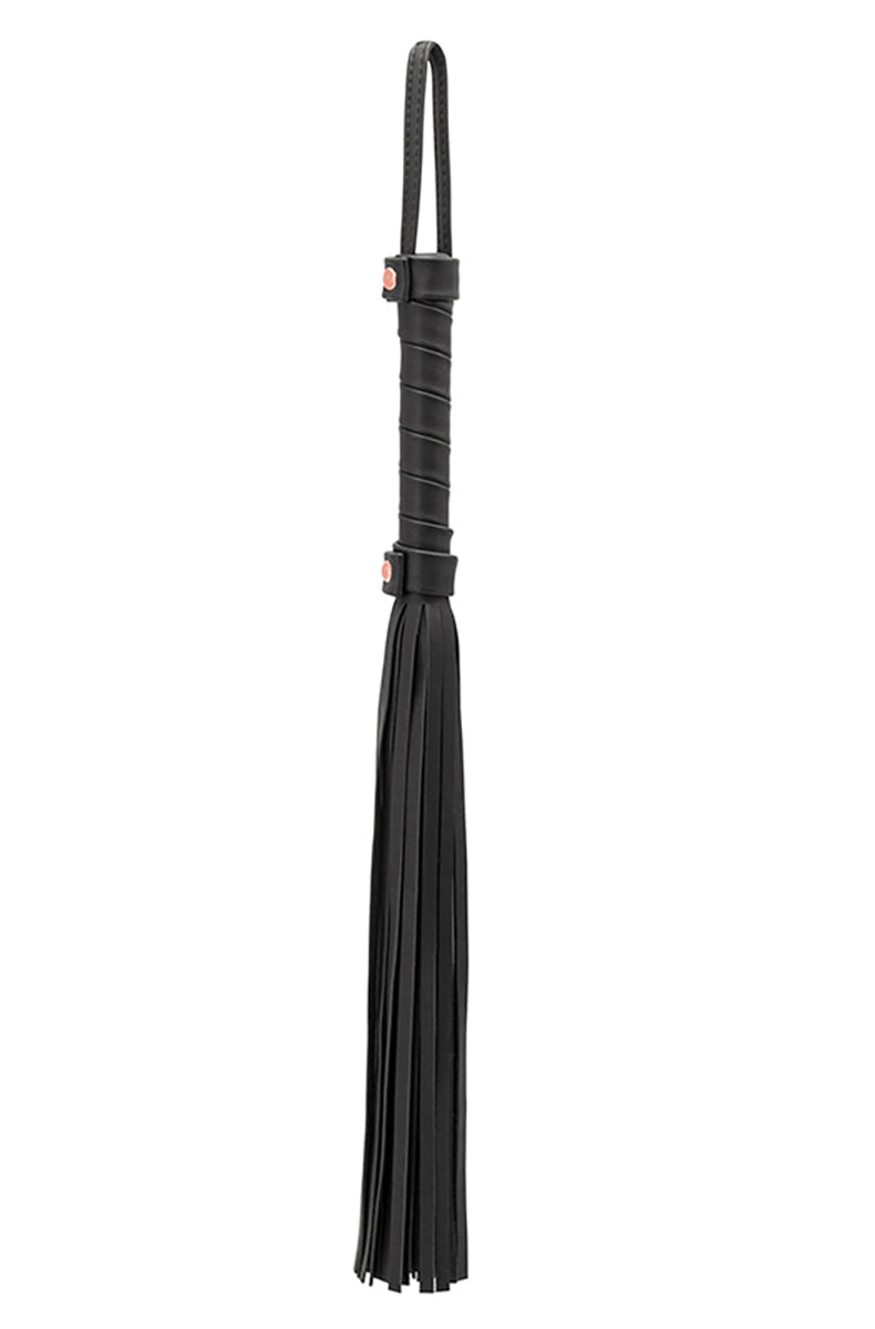 Front view of the black flogger with thin falls draped from a black wrapped handle with rose-gold rivet hardware.