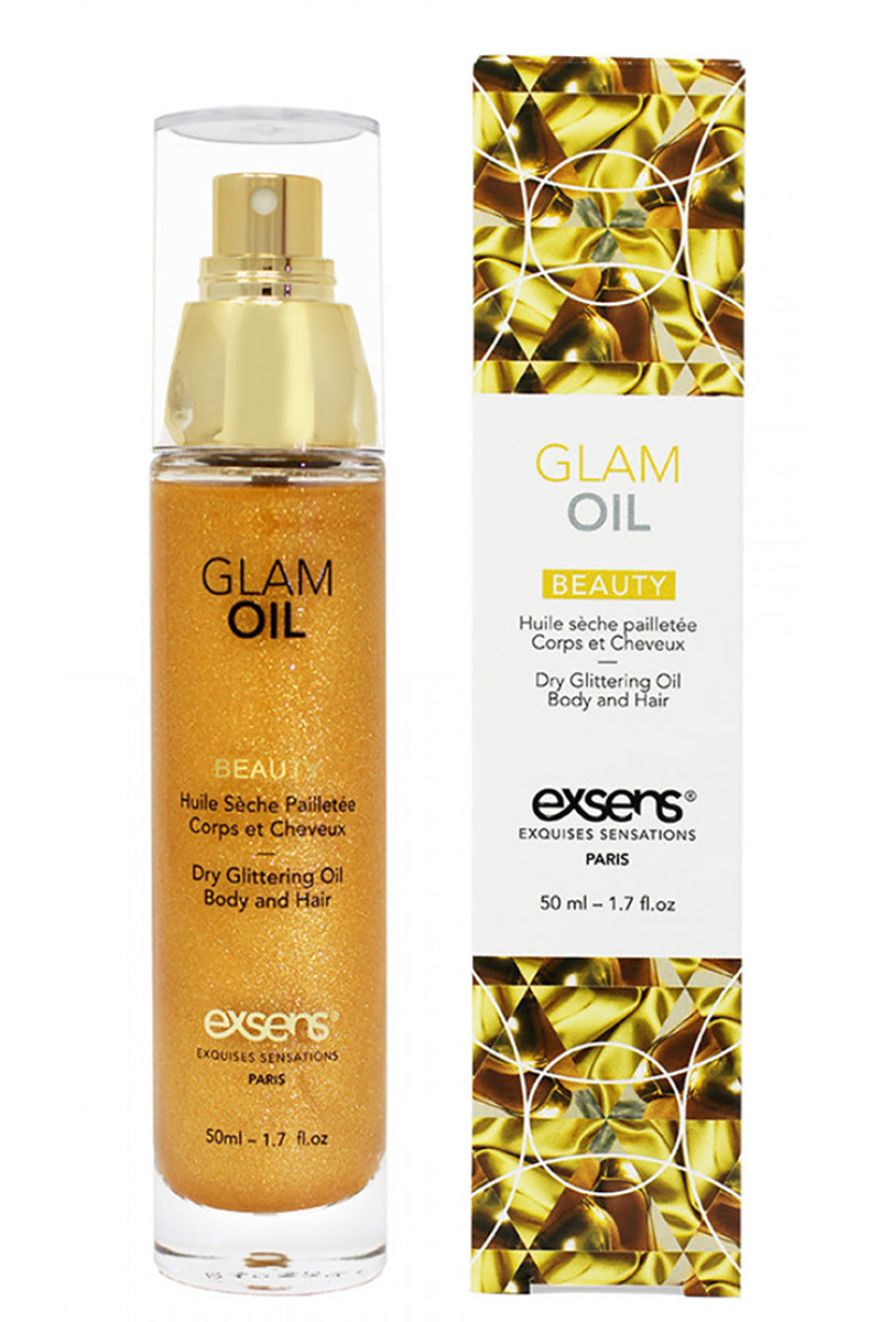 Exsens Gold Glitter Glam Oil bottle label closeup showing brand name and ingredient information.