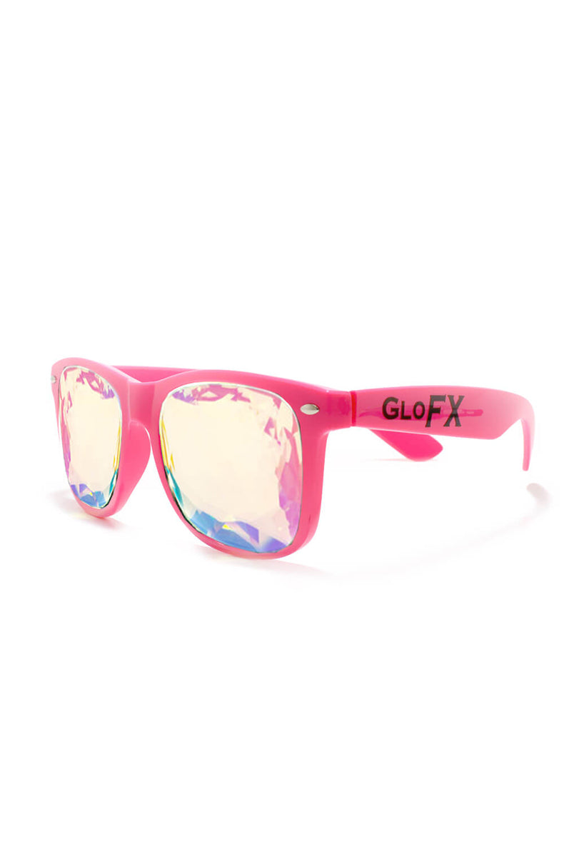 Wayfarer-style sunglasses with glossy hot-pink frames and faceted yellow-and-blue kaleidoscope crystal lenses.