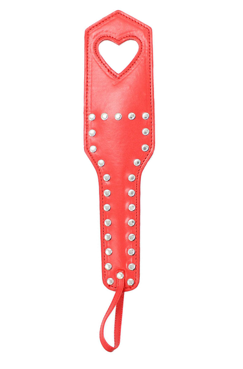 Red vegan leather paddle with a heart-shaped cutout outlined in silver studs and rows of studs along the handle.