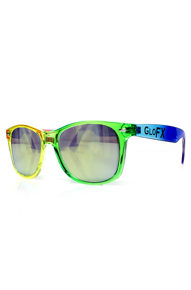 Wayfarer-style sunglasses with transparent rainbow yellow-green-blue frames, GloFX branding on the blue temple, and gold-mirror diffraction lenses.