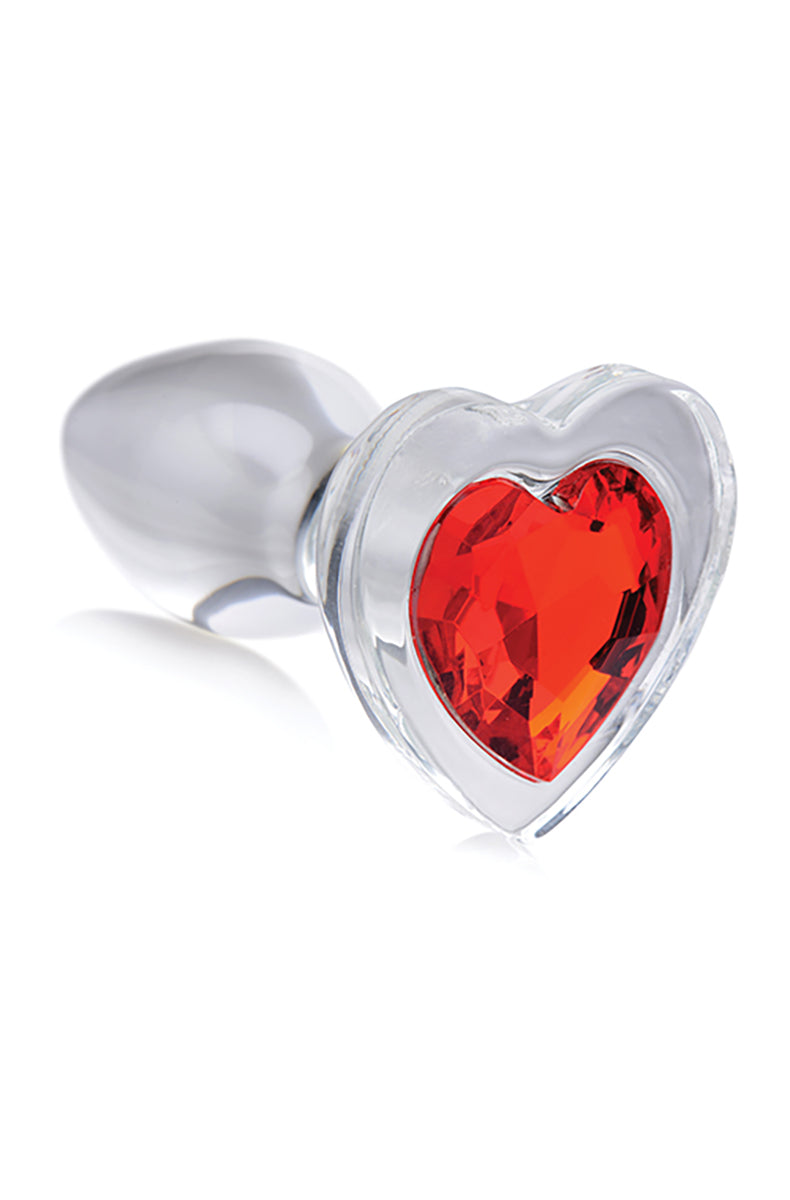 Small clear borosilicate glass anal plug with tapered teardrop body and faceted red heart gem set in the flared base.