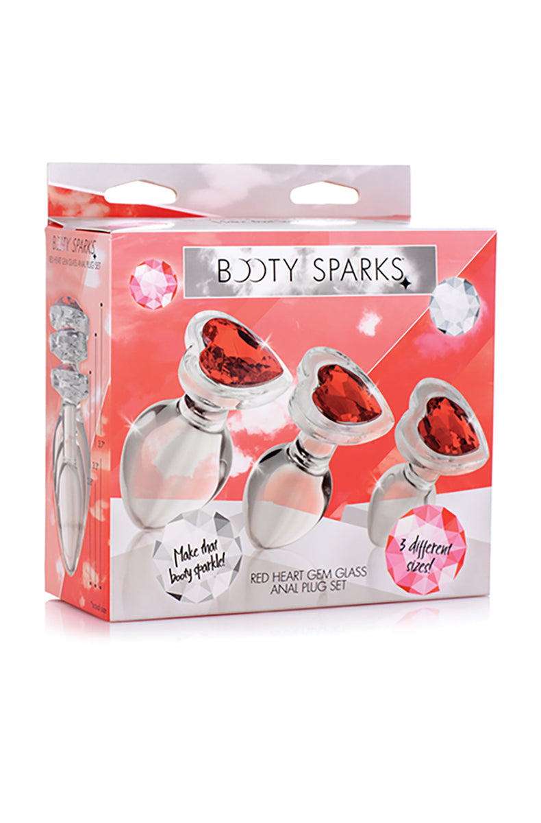 Red heart glass butt plug set lined up showing three sizes and three red heart gem bases.
