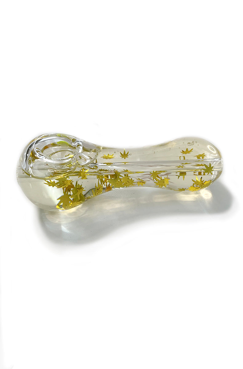 Side view of freezable spoon pipe in clear borosilicate glass filled with glycerin and gold hemp leaf glitter.