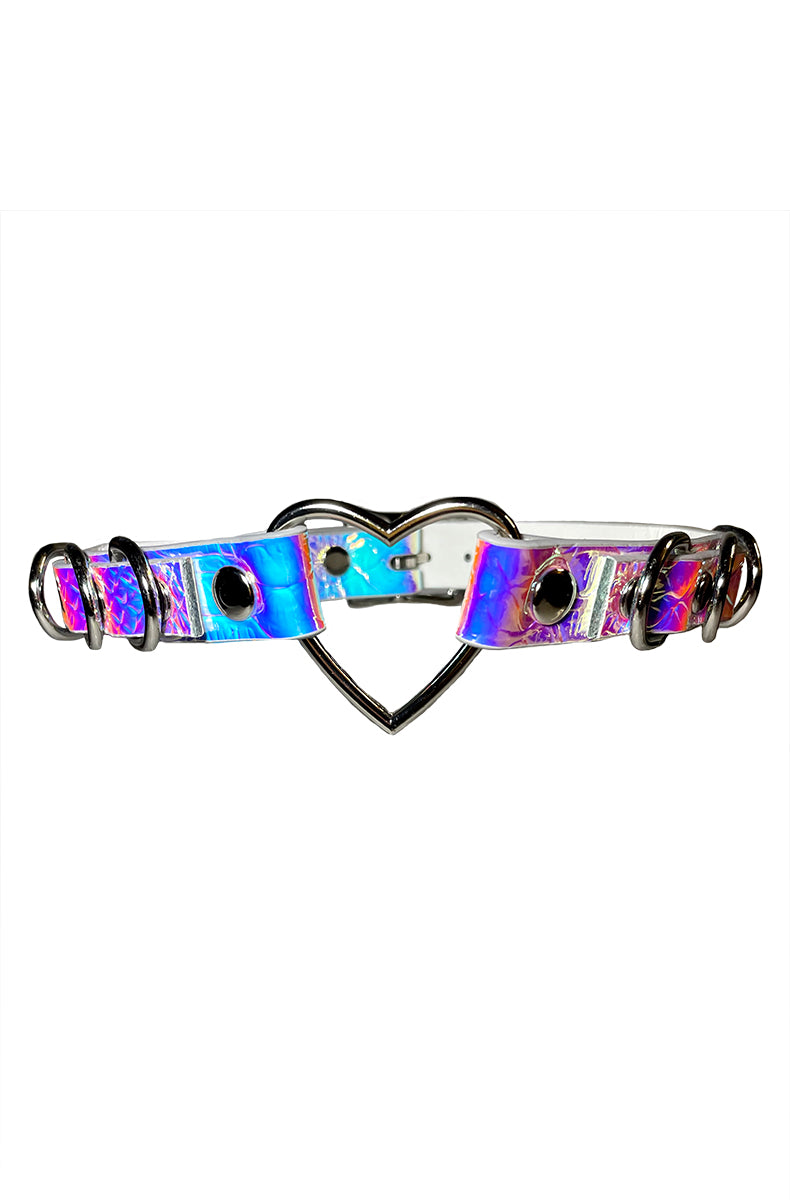 Holographic purple-pink-blue vegan leather collar with a silver heart-shaped opening ring at the front and multiple silver D-rings along the strap.