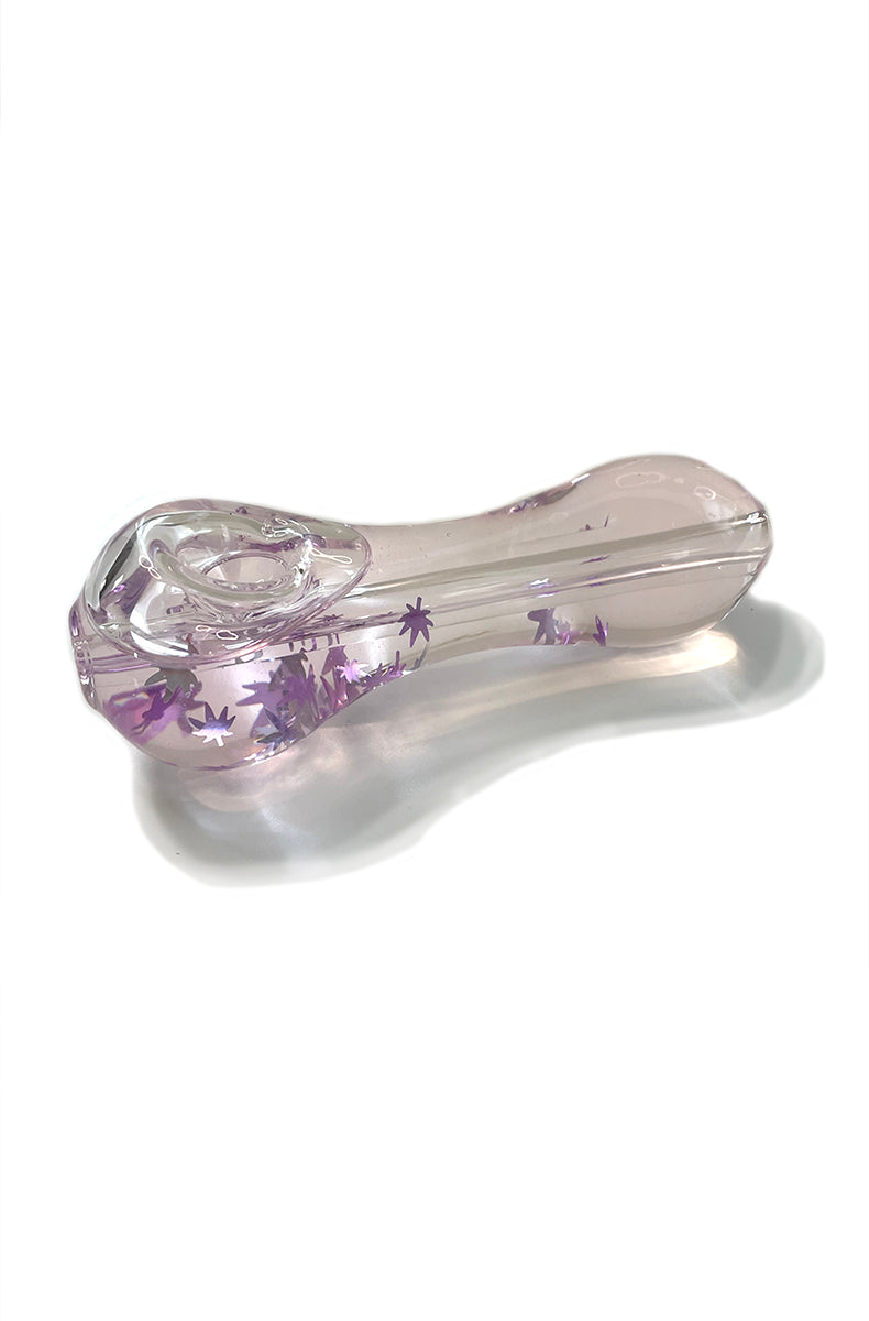 Side view of freezable spoon pipe in clear borosilicate glass filled with glycerin and purple hemp leaf glitter.