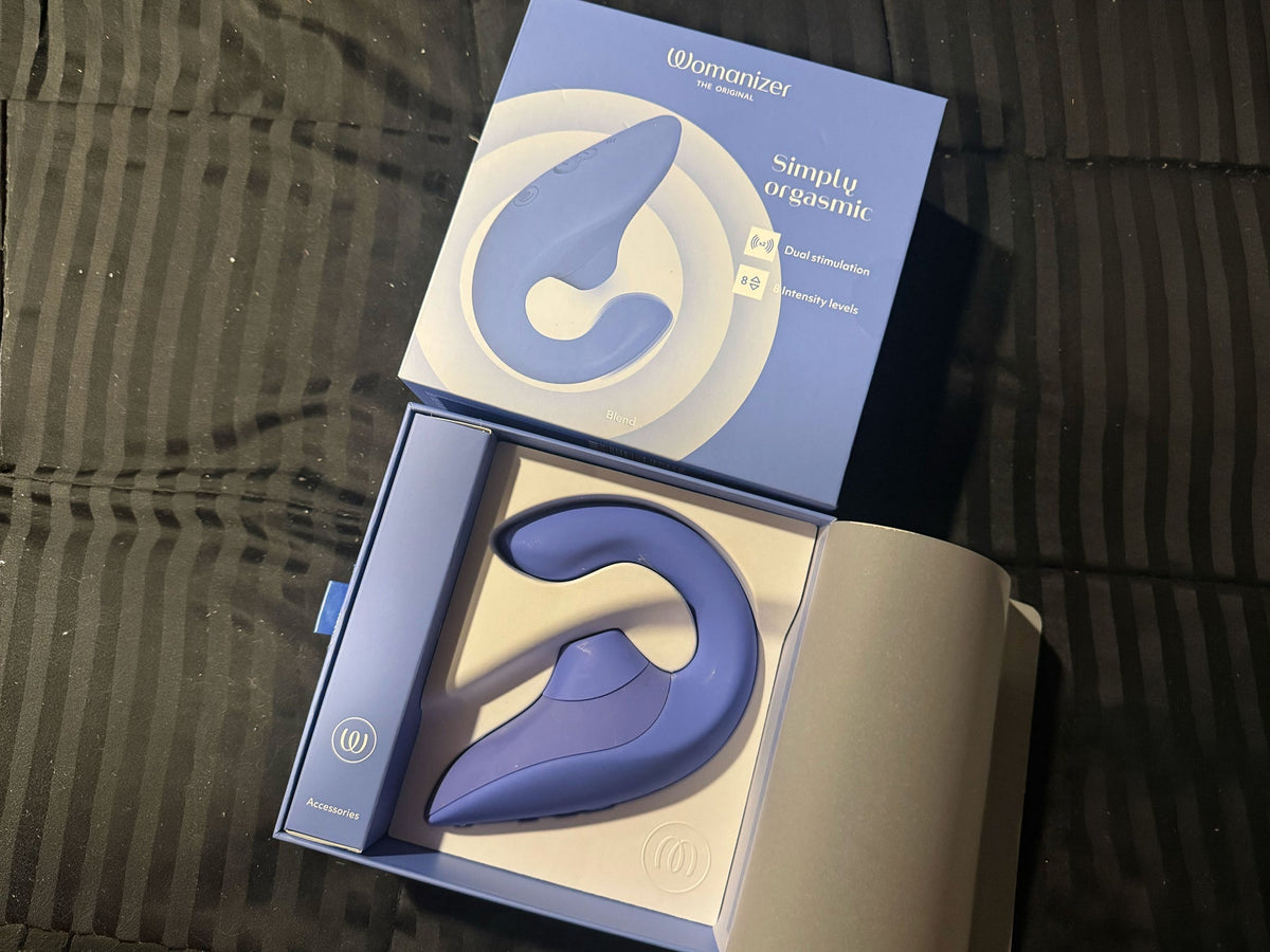 Womanizer Blend in periwinkle sitting in its open box