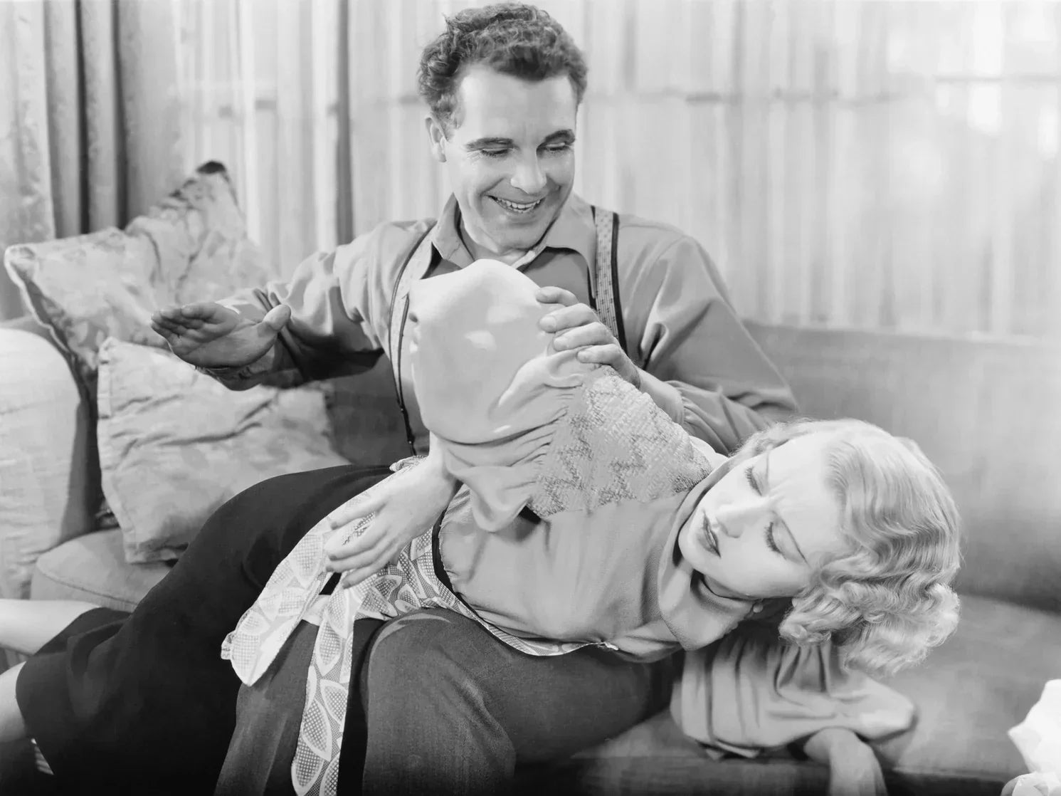 Beginner's guide to spanking: a woman's hand holding a paddle, making impact play sexy not scary