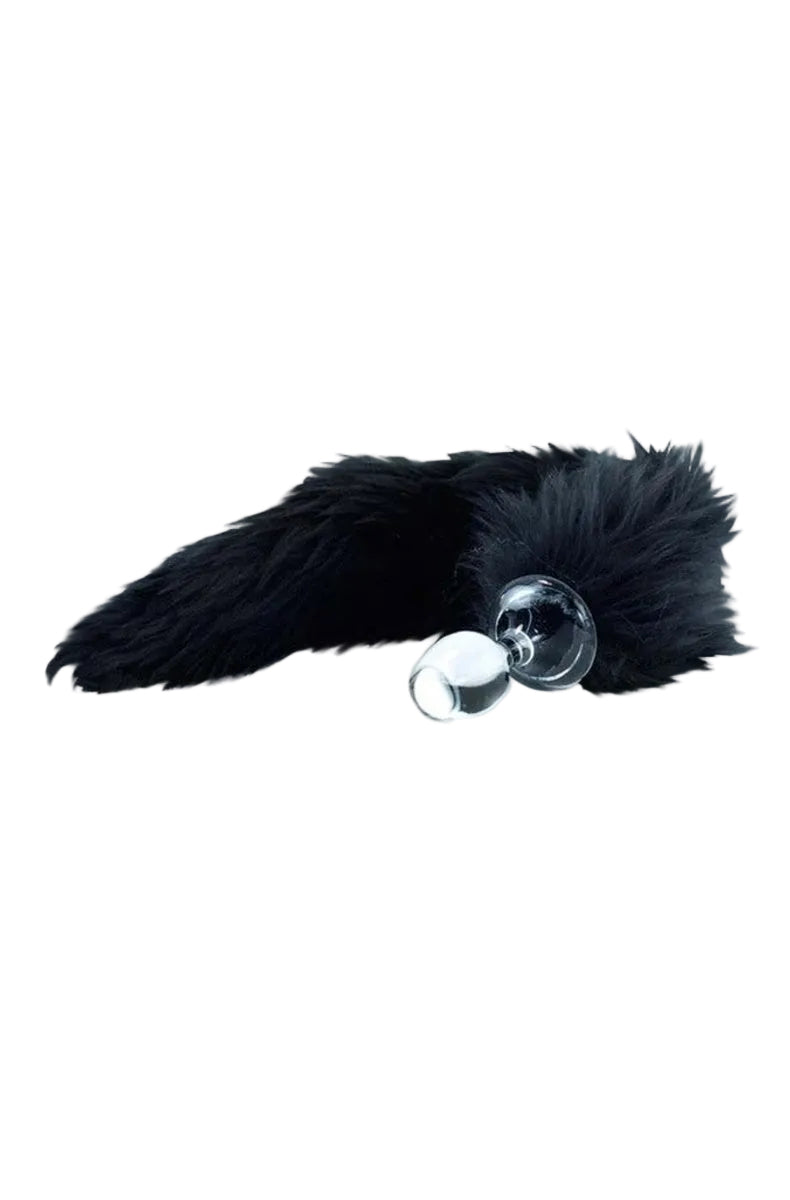 Clear glass butt plug with a long black faux fur tail