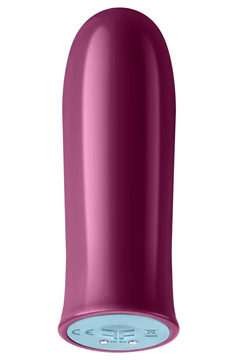 FemmeFunn Versa Bullet in dark fuchsia, compact bullet vibrator with magnetic charging contacts on the base.
