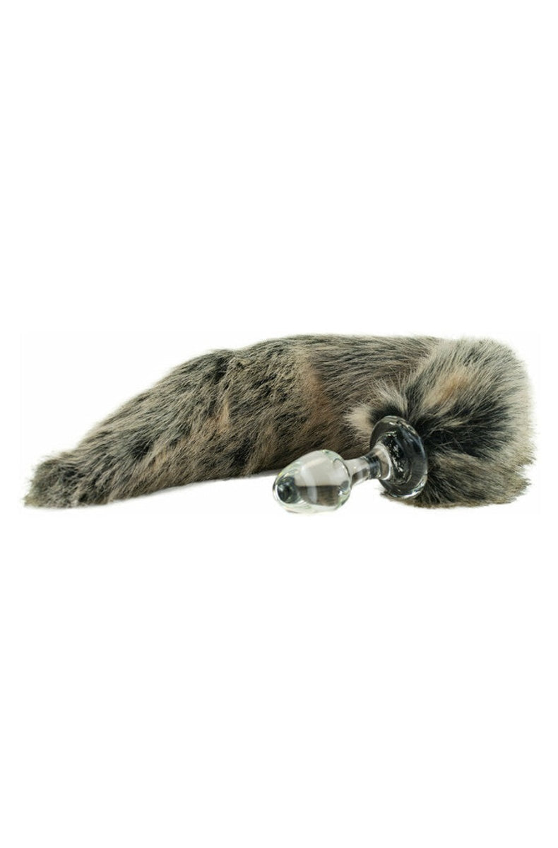 Clear glass butt plug with a long grey wolf faux fur tail with darker tips