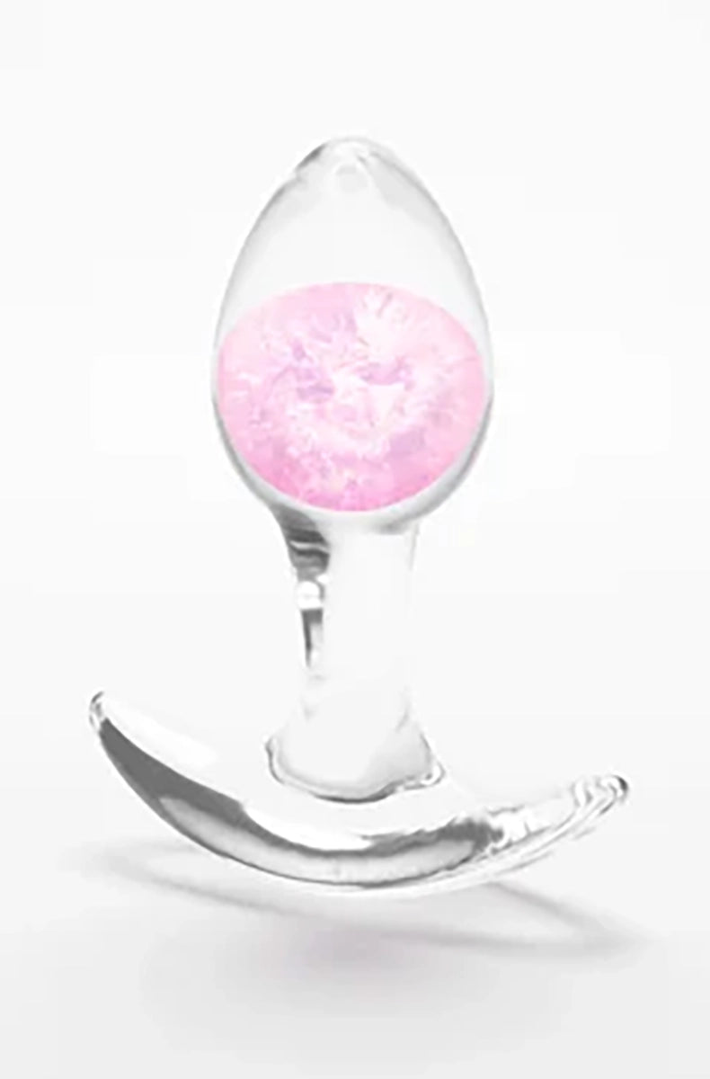 Clear silicone butt plug with a swirled pink glass marble inside the bulb, standing on its wide flat base