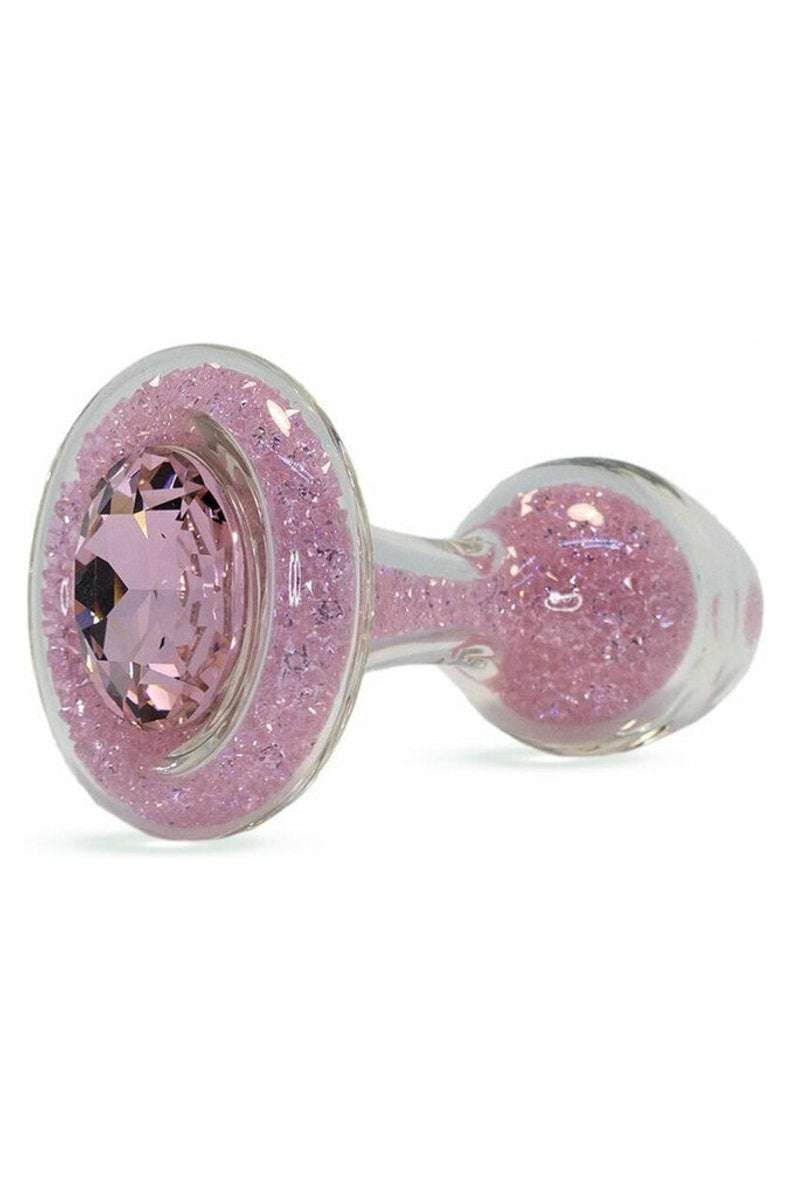 Pink sparkle glass butt plug with tiny crystals inside and a faceted pink crystal in the flared base
