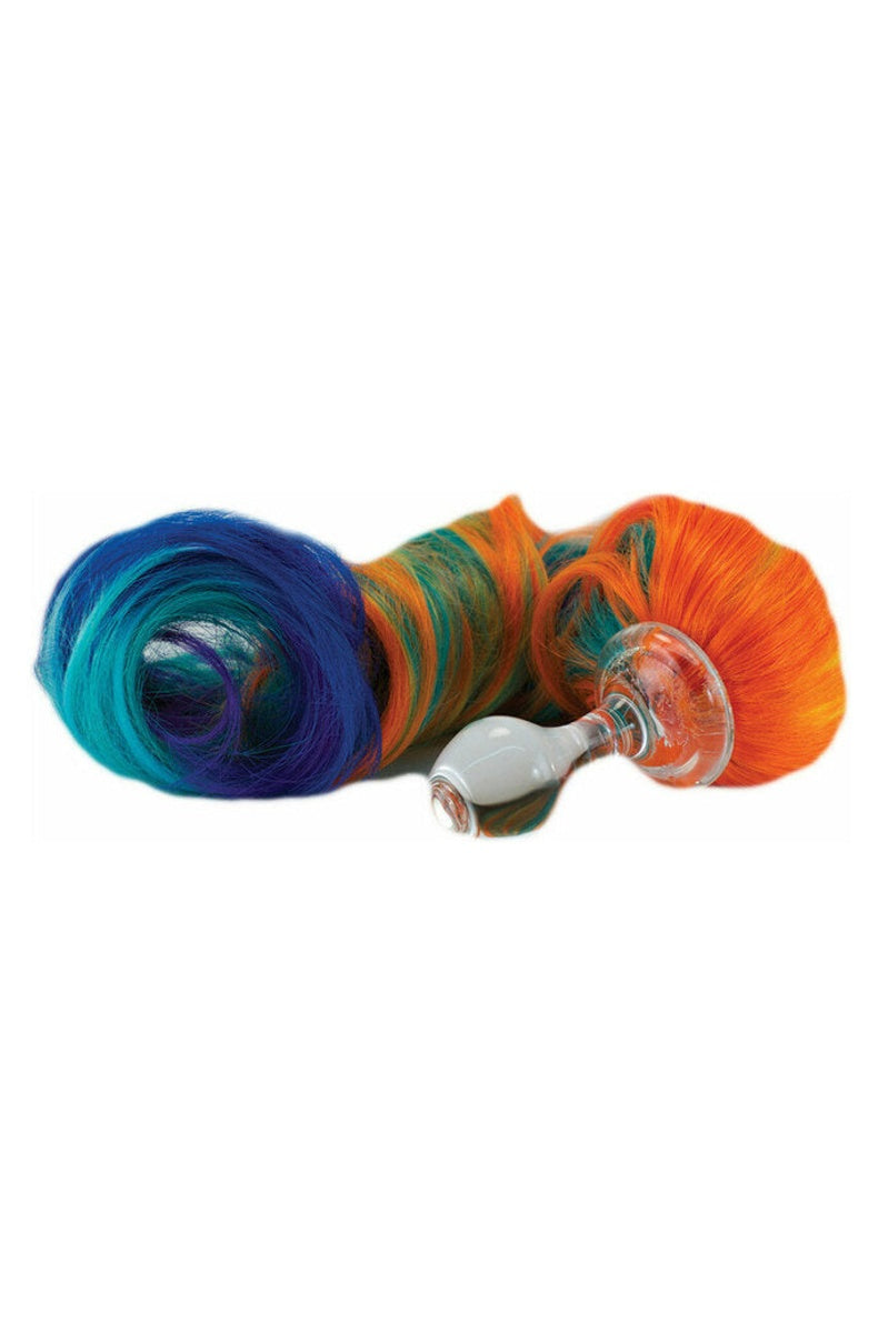 Clear glass butt plug with a long curly rainbow pony tail in blue, green, orange and red