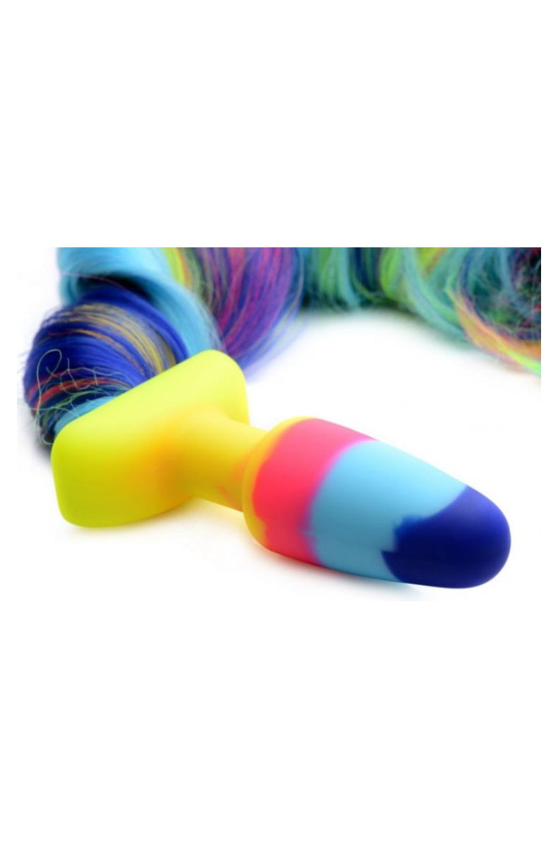 Rainbow unicorn tail butt plug: navy, cyan and coral silicone plug with a yellow flared base and long rainbow tail