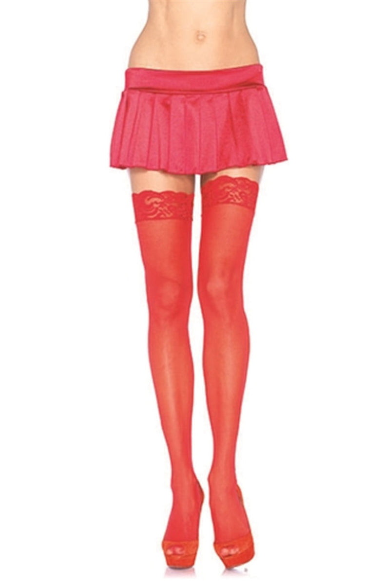 Sheer red thigh highs with lace tops, worn with a red mini skirt
