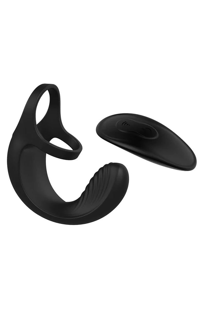 Zero Tolerance Vibrating Ball Cradle cock ring in black beside its wireless remote