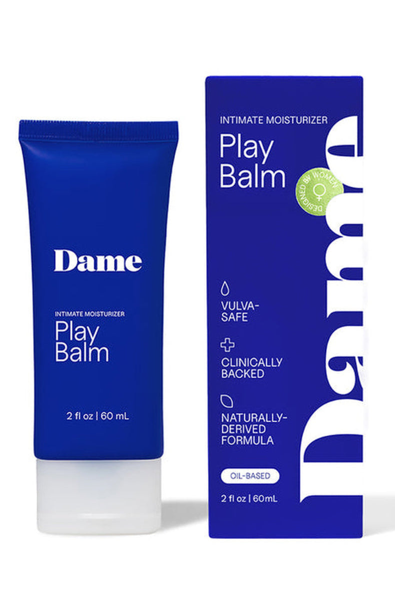 Dame Play Balm tube beside its box, marked vulva safe, clinically backed, oil based, 2 fl oz.