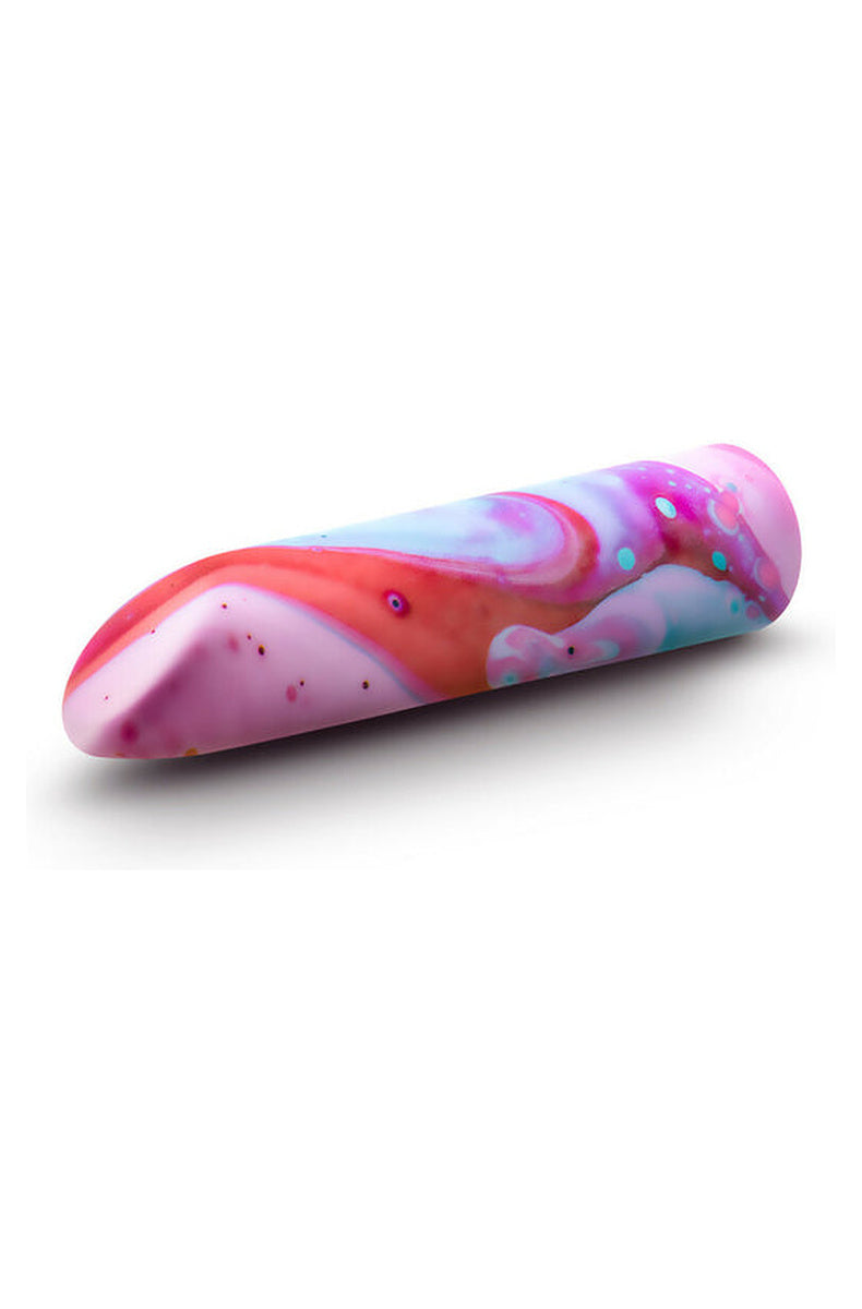 Marbled Fascinate power bullet lying flat, showing the swirl pattern along its full length.