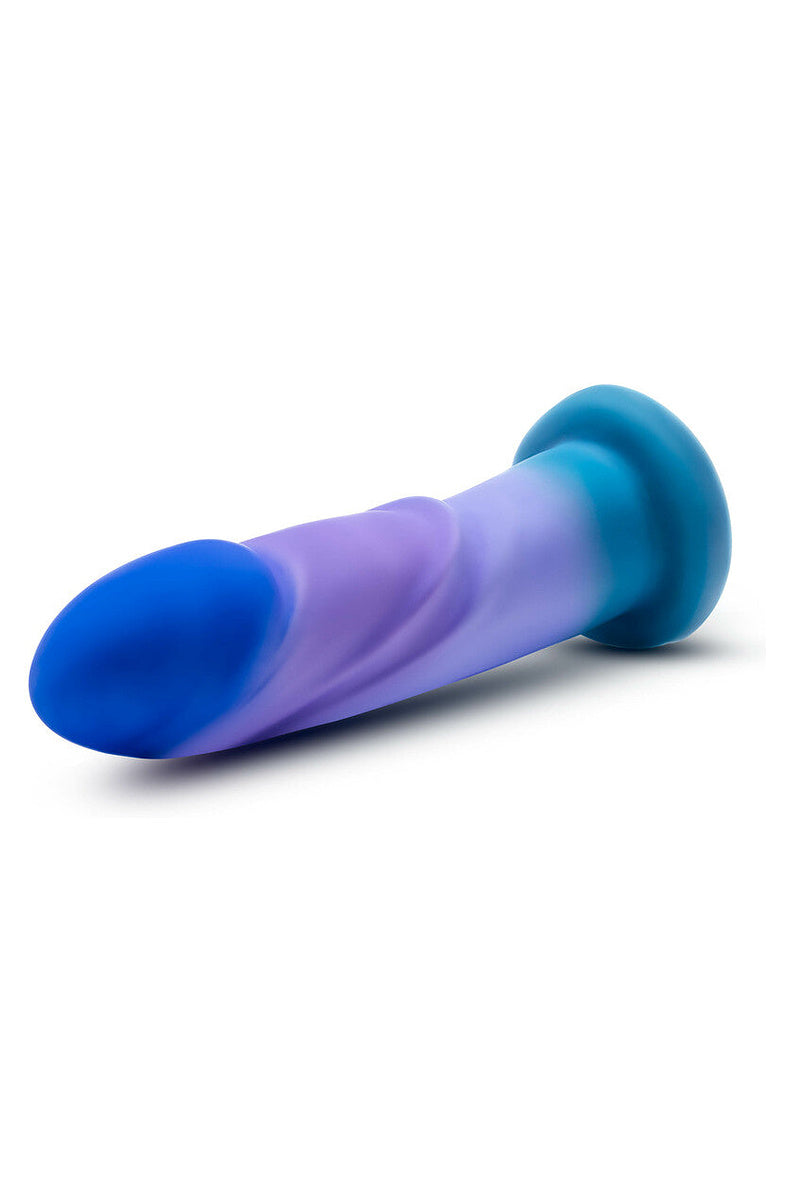 Blue, purple and teal dildo lying on its side with the teal suction base