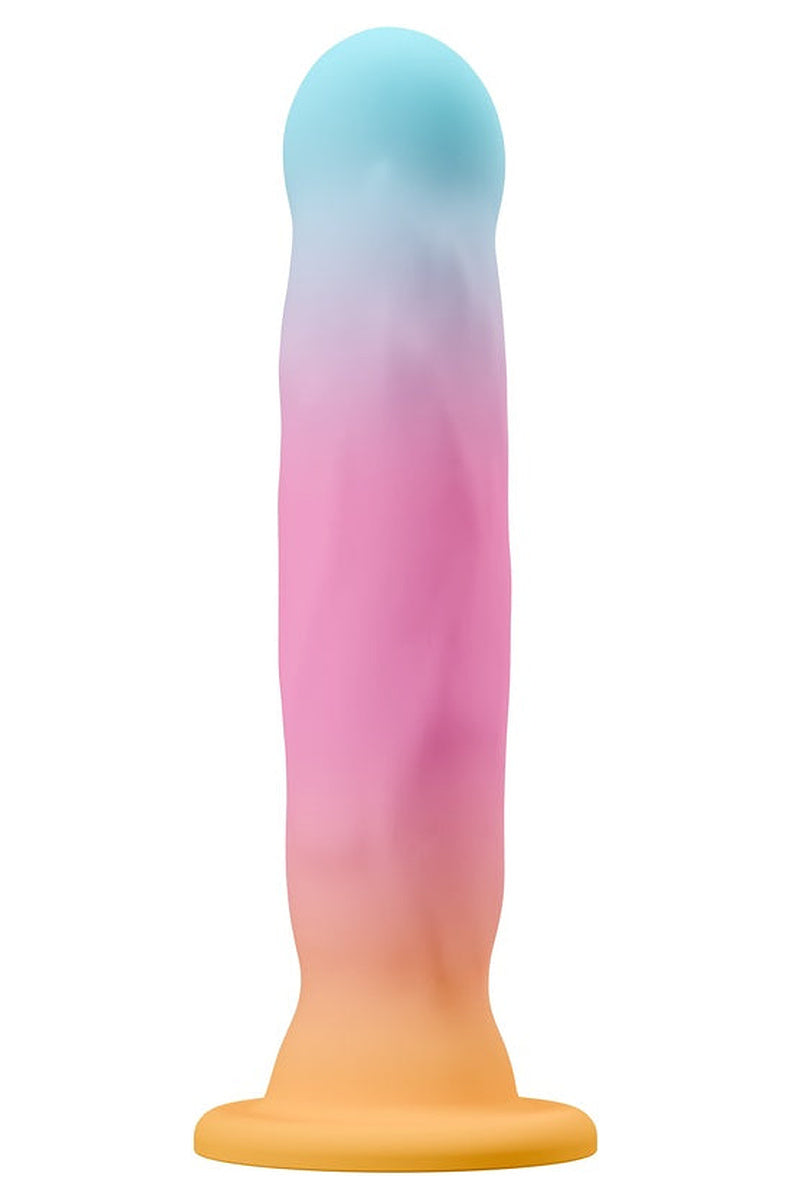 Aqua, pink and gold dildo turned slightly to show its soft ridges