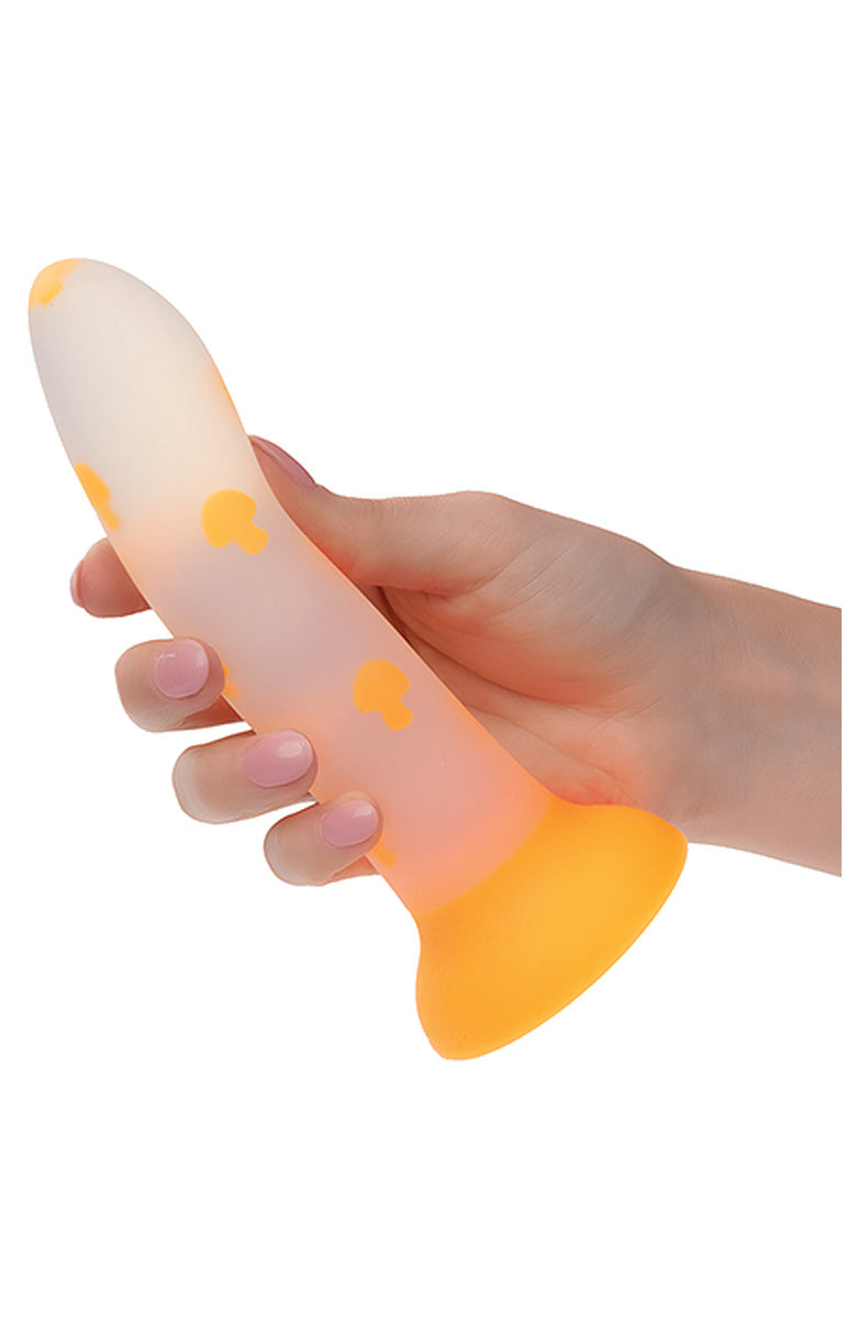 Hand holding the frosted orange mushroom dildo to show its size