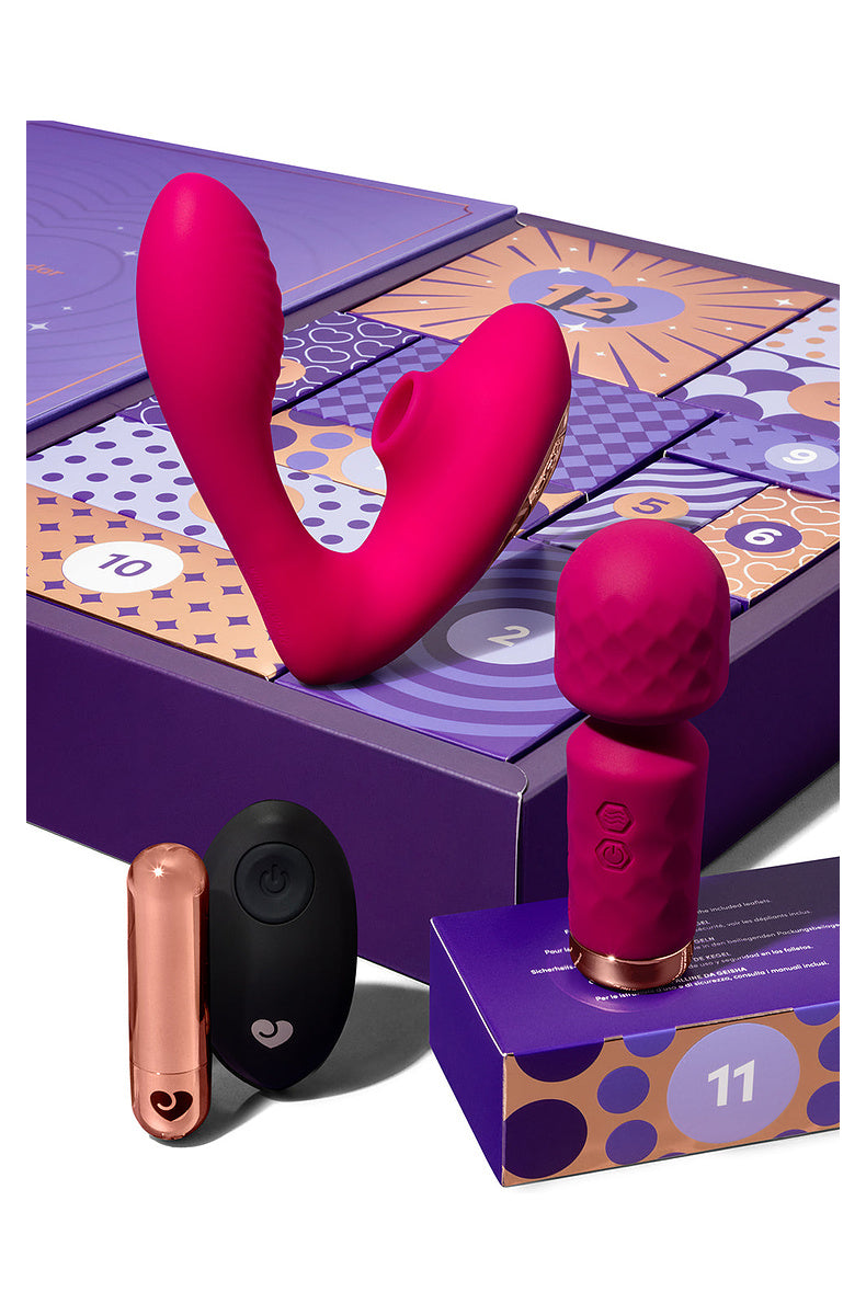 Pink G-spot and clitoral dual stimulator, mini wand, rose gold bullet and remote on the calendar doors