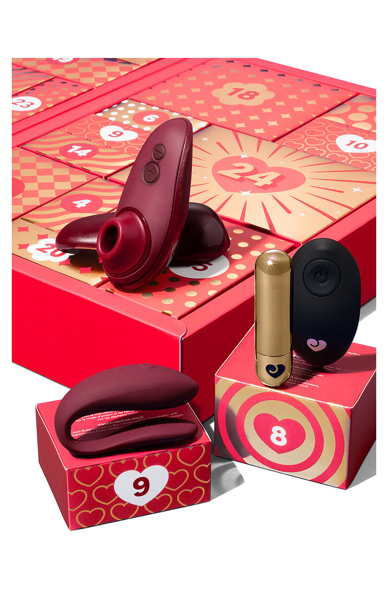 Burgundy Womanizer Liberty 2, We-Vibe Sync Lite and gold bullet with remote on the calendar doors