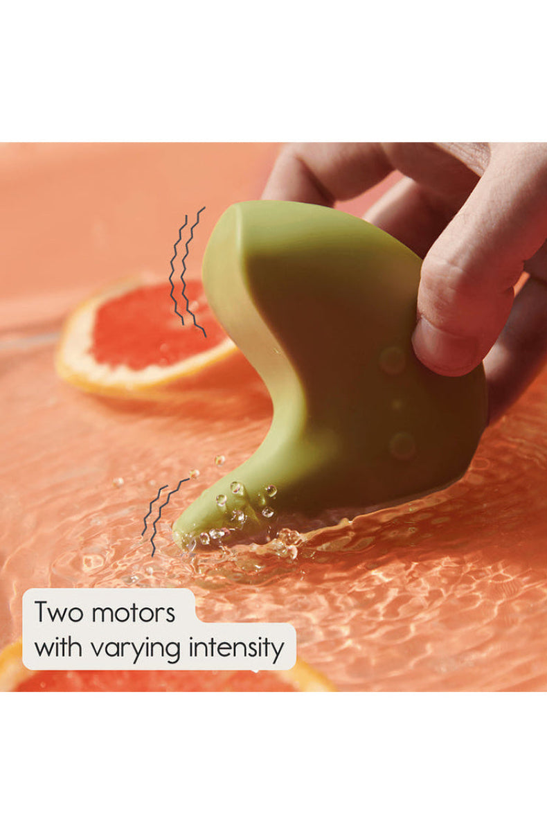 Kiwi massager held up, marked with the two motors that run at different intensities.