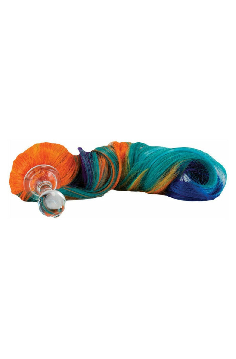 Curly rainbow pony tail laid out to show its length next to the clear glass plug
