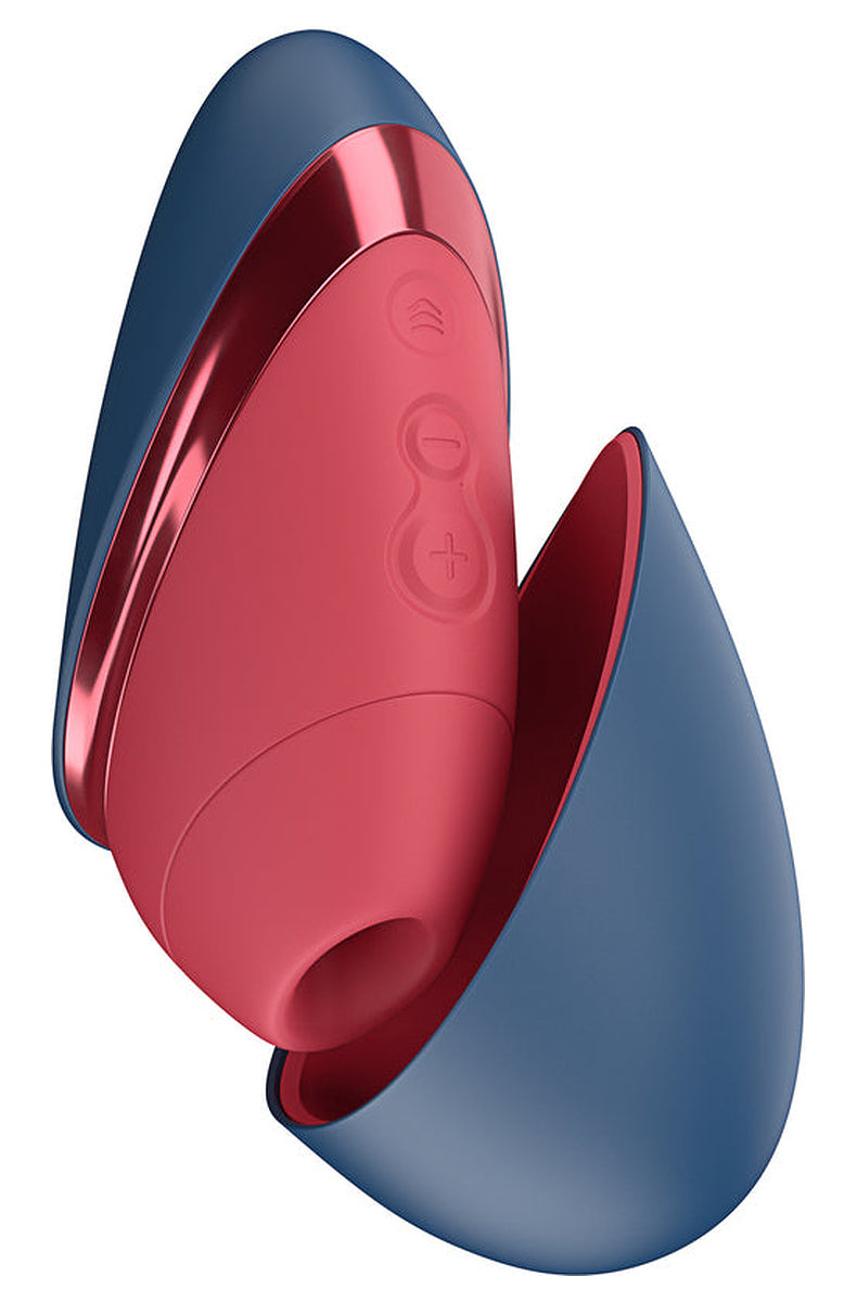 Blue/Red Womanizer Next Liberty: red body with a blue magnetic cap partly open over the silicone head.