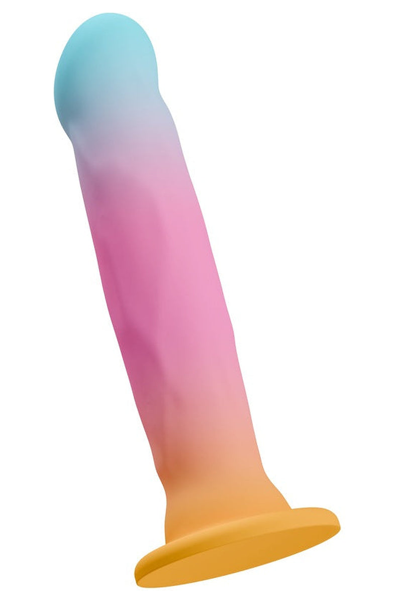 Aqua, pink and gold ombre dildo tilted to show its gentle curve