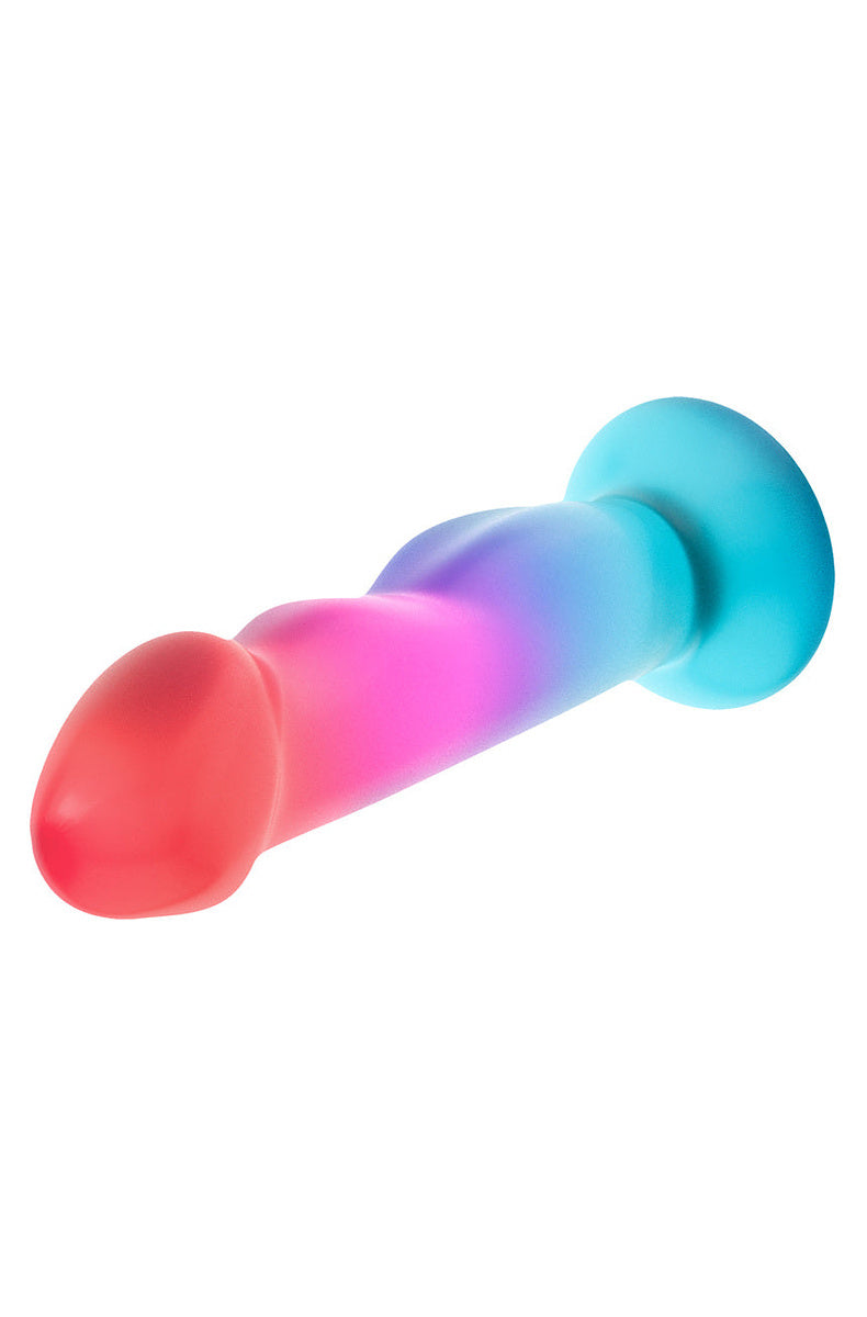 Coral, pink and aqua ombre dildo lying on its side