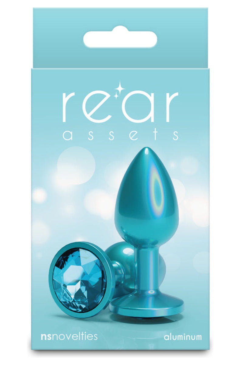 Teal aluminum butt plug in its retail box, plug and round gem base shown on the front
