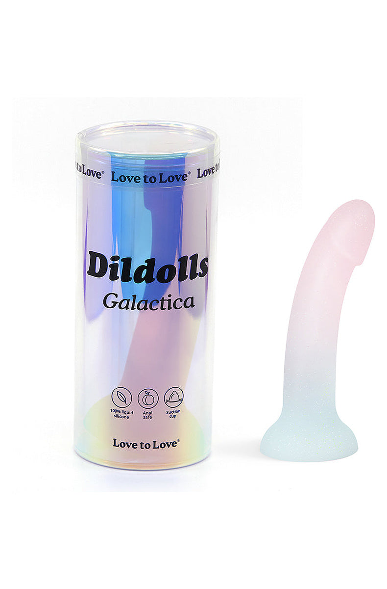 Pearl and mint glitter silicone dildo next to its holographic tube packaging
